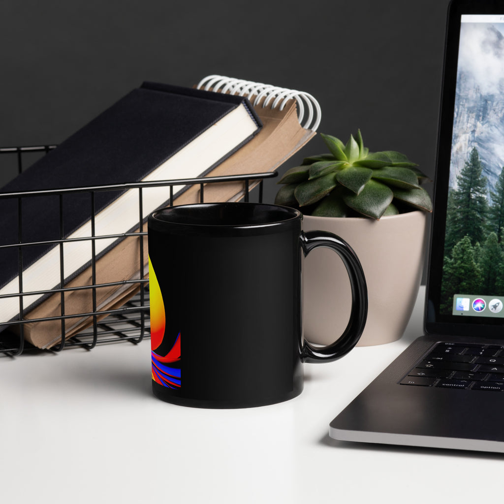 Solar Lotus Black Glossy Mug lifestyle – black ceramic mug, right view on desk, psychedelic abstract art in yellow, orange, red and blue.