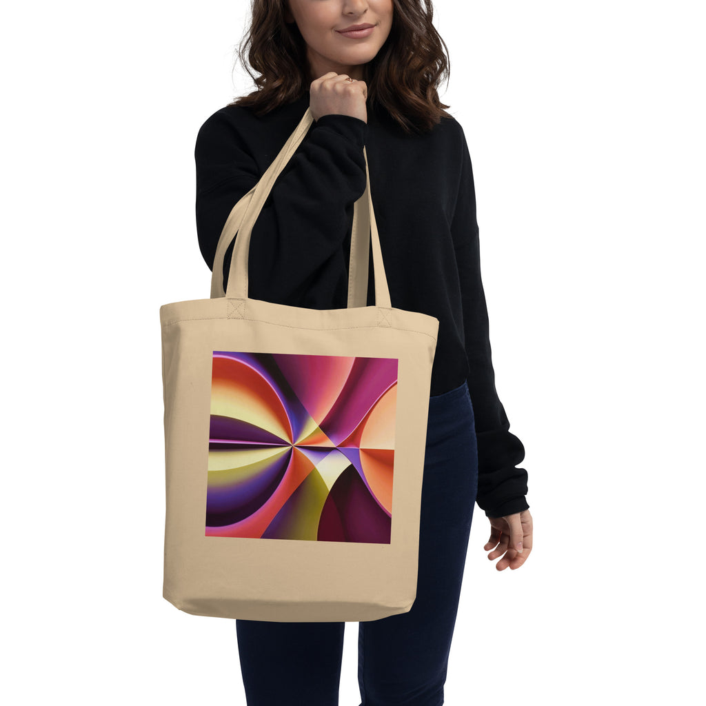 Model carrying the Story of Colour cream tote bag with colourful geometric artwork.
