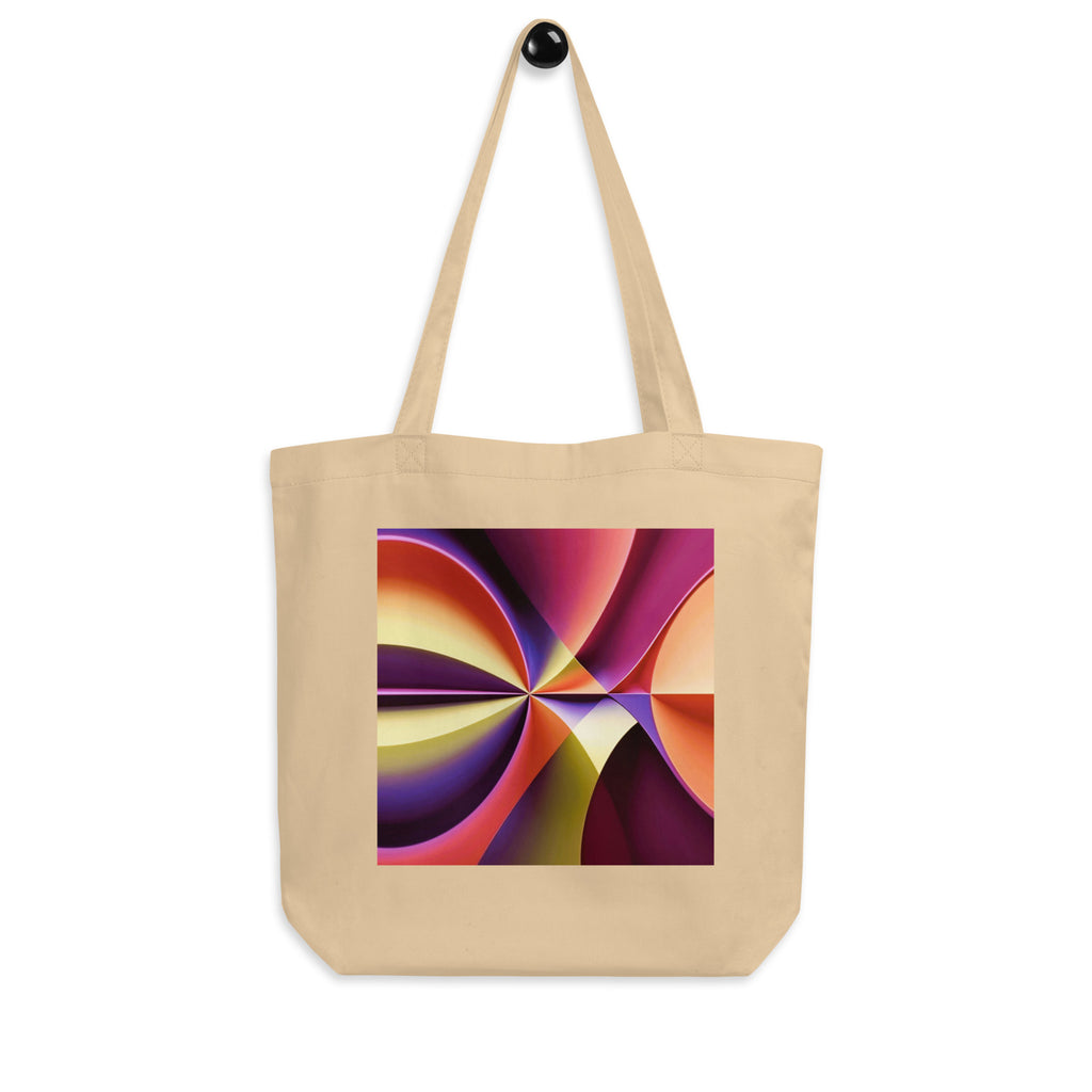 Story of Colour cream tote bag hanging from a wall hook, showing the geometric print and long straps.